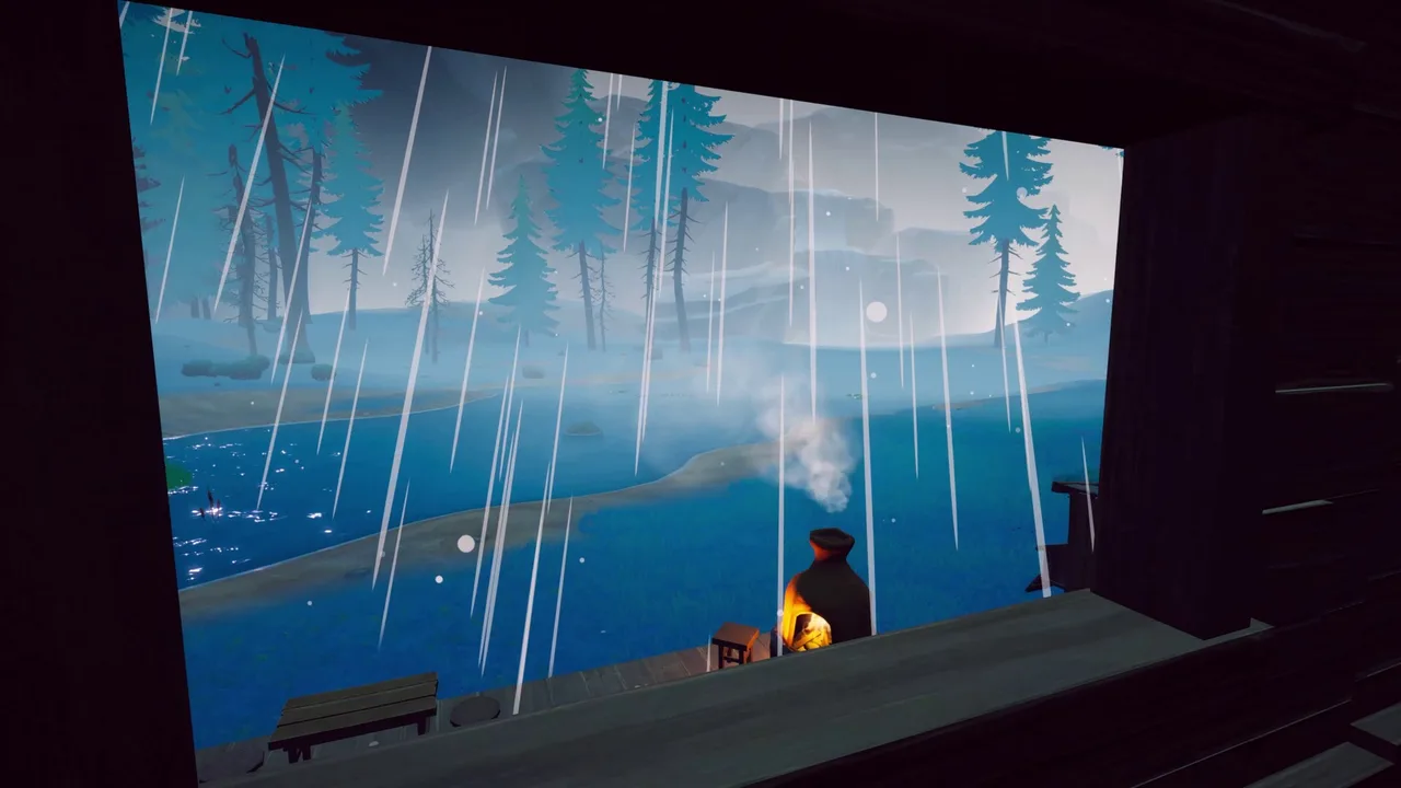 Rain falling outside the window of a cozy wooden cabin